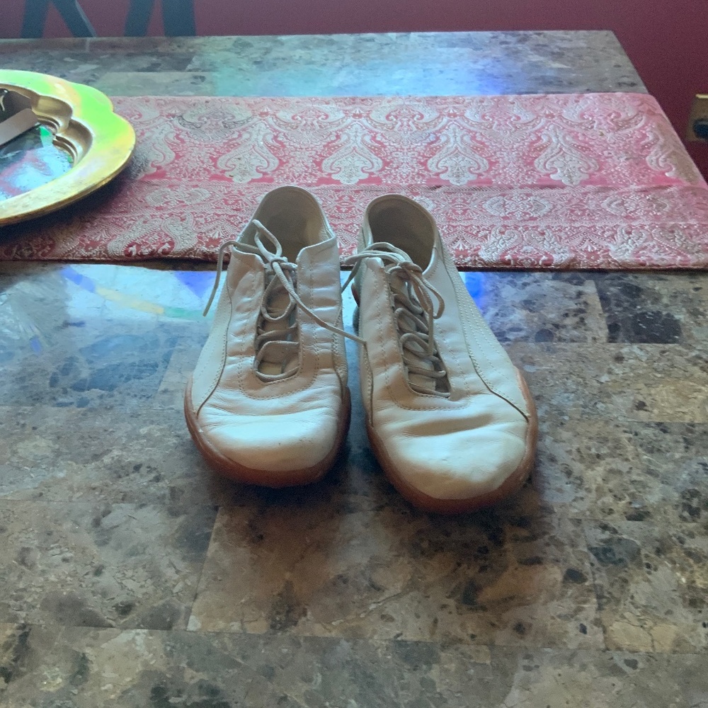 White and gold vintage leather Puma sneakers